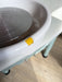 Yellow push-button release on the Daisy pottery wheel splash pan