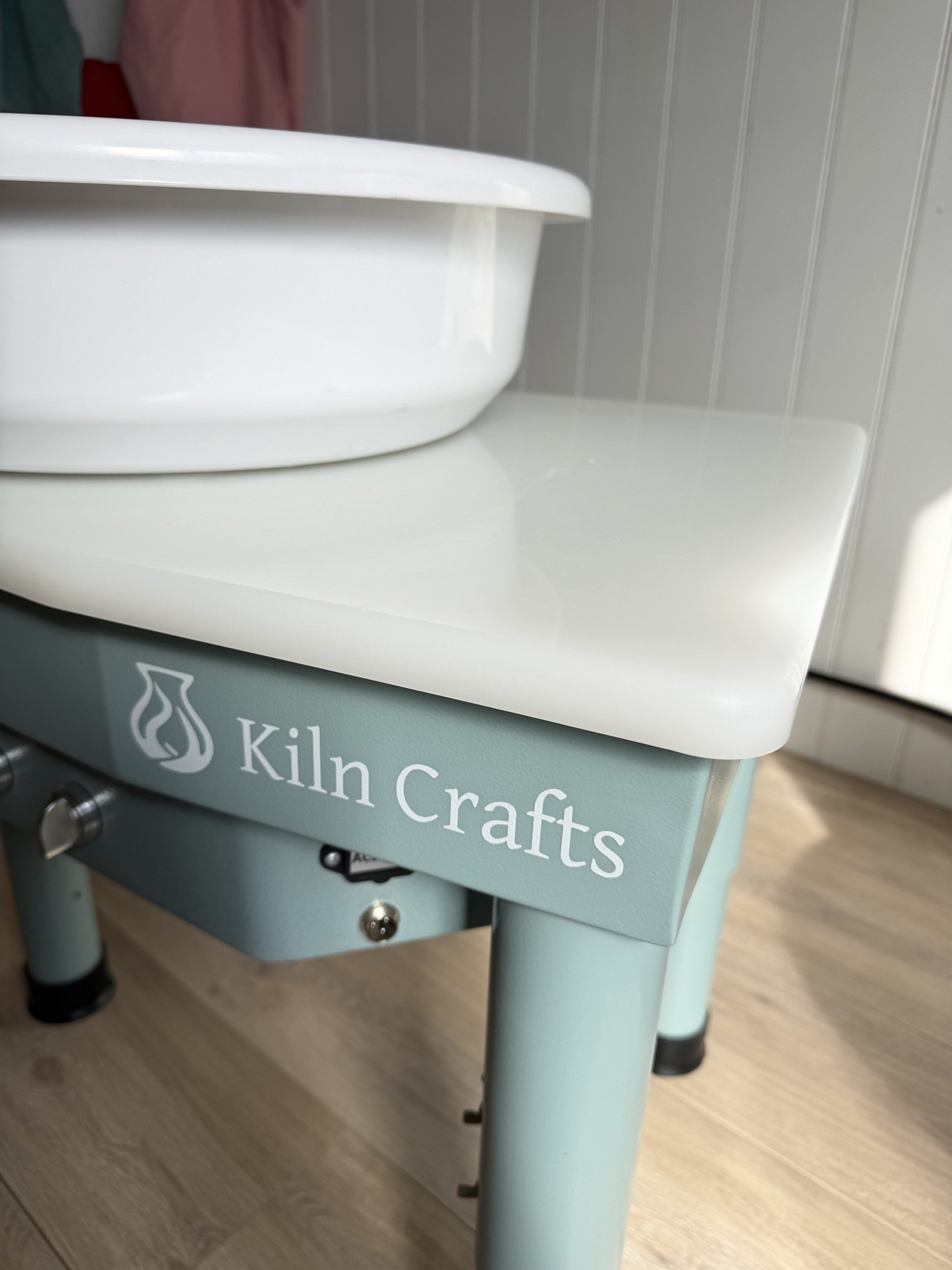 Smooth white wipe-clean top on the Daisy pottery wheel