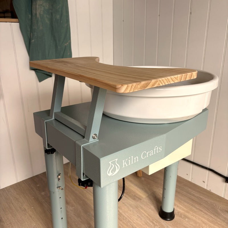Kiln Crafts Daisy Wheel Shelf fitted to the Daisy pottery wheel — side view with wheel spinning