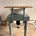 Kiln Crafts Daisy Wheel Shelf fitted — close-up of solid wood shelf on teal powder-coated steel frame
