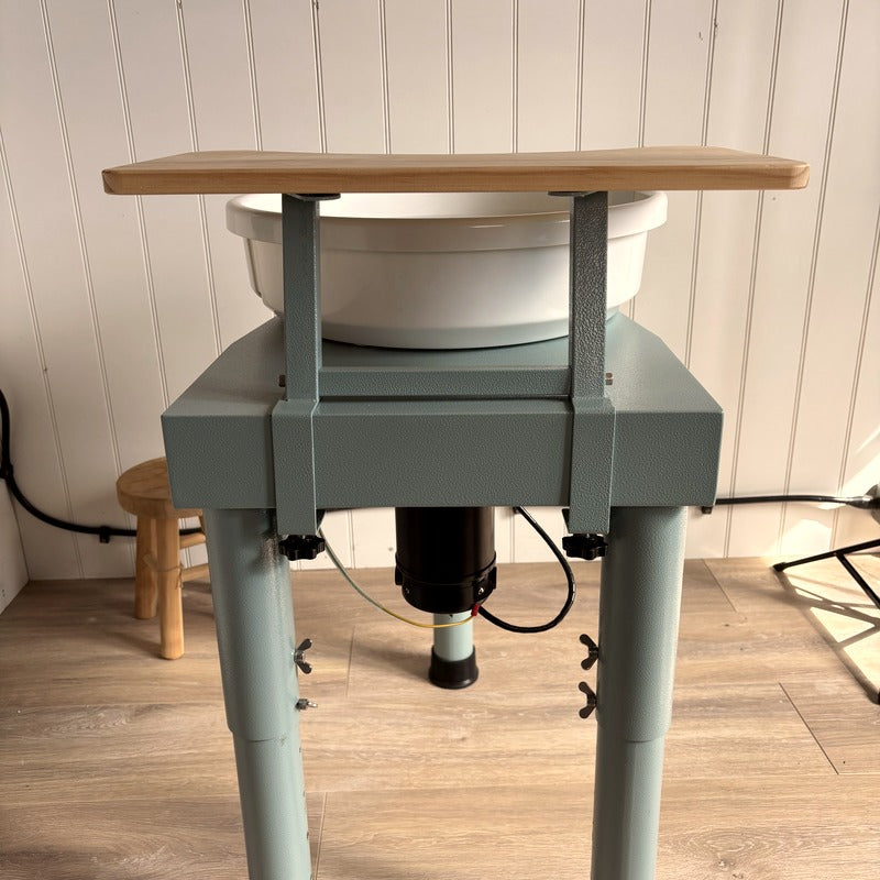 Kiln Crafts Daisy Wheel Shelf fitted — close-up of solid wood shelf on teal powder-coated steel frame