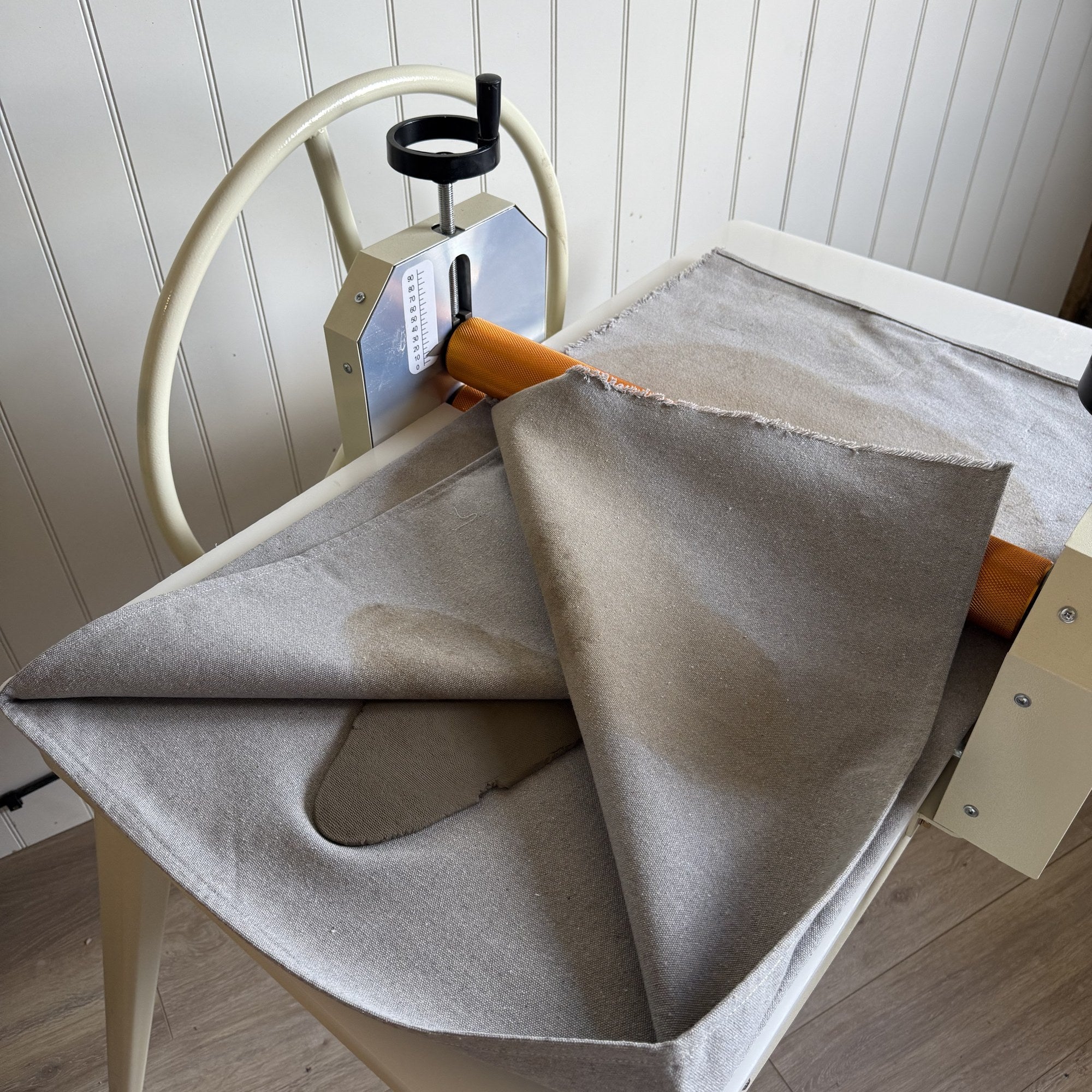 Replaceable canvas rolling cloth on the Kiln Crafts Clay Roller slab roller bed