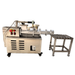 Kiln Crafts Mini de-airing pugmill front view showing the flanged clay outlet nozzle, vacuum gauge and exhaust valve on top, with the stainless extrusion roller table alongside
